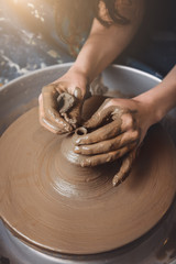 Artisan pottery woman making a small pot