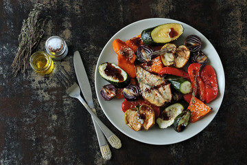 Plate with baked vegetables. Vegan Lunch Healthy food.