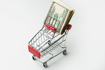 Grocery cart with Bitcoin wheels. The concept of technological breakthrough, online shopping.	