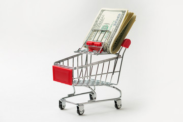 Grocery cart with Bitcoin wheels. The concept of technological breakthrough, online shopping.	