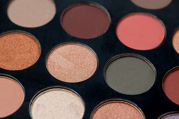 Colorful eye shadows palette. Colorful make-up palette background.