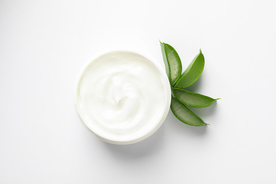 Composition with natural treatment accessories on white background, top view and space for text. Aloe vera