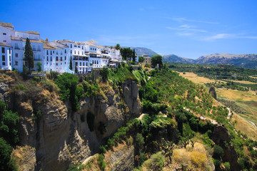 View on ancient village Ronda located on plateau surrounded by rural plains in Andalusia, Spain