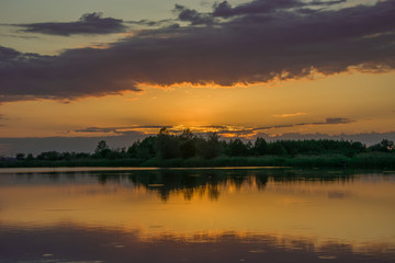 Orange sky after sunset on the lake