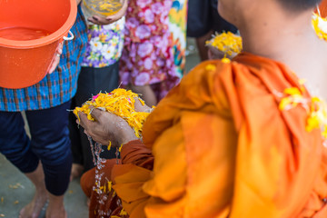 water pouring to monk in Songkran festival tradition of thailand