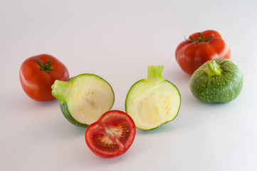 Green zucchini and  tomatos