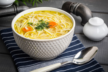 Tasty meat broth with noodles.