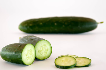 Cucumber slices on a white background 