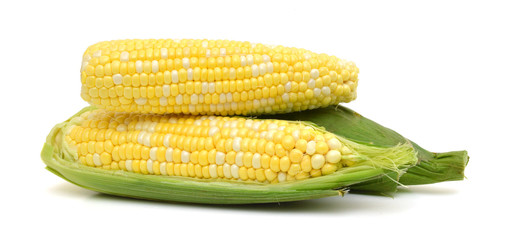 fresh corn fruits with green leaves isolated on white background