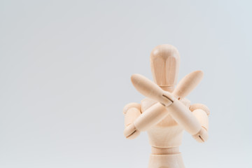 Refusal gesture, Wooden dummy, crossed hands on white background, copy space for your object or text