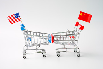 Closeup shopping cart with USA and China flag for tariff trade war between United States and China...