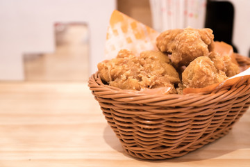 Breaded crispy fried chicken drumctick in the basket