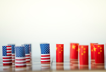 Fototapeta na wymiar USA flag and China flag on chess board for tariff trade war between United States and China who conflict because of both increase tax barrier of import and export product. Government and business.