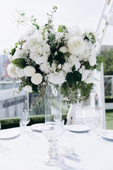 Wedding flower decorations from white roses. Decoration for the ceremony.