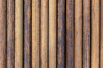 Rusty grunge pipes horizontal background. Orange corrosion rust on steel metal factory industrial pattern. Rough texture brown parallel stack close up