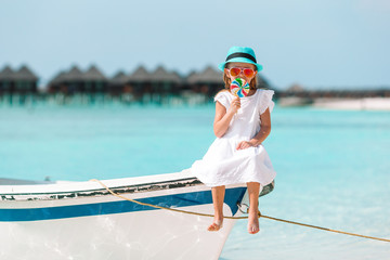 Adorable little girl on boat during summer vacation