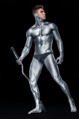 Fototapeta na wymiar Brutal strong muscular bodybuilder athletic man pumping up muscles with barbell on black background. Workout bodybuilding concept. Copy space for sport nutrition ads.