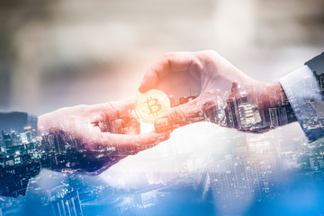 Double exposure of business give and bitcoin the new virtual electronic money with blur city night, investment concep