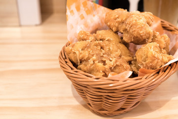 Breaded crispy fried chicken drumctick in the basket