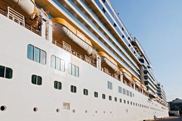 open deck of a cruise ship near the pier.