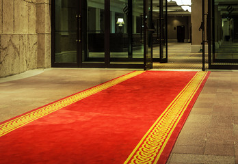 Red carpet hotel entrance door