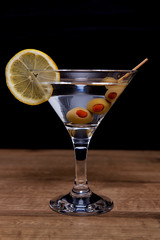  Martini cocktail on wooden table 