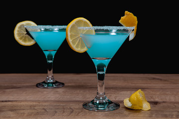 Blue alcoholic drink on black background