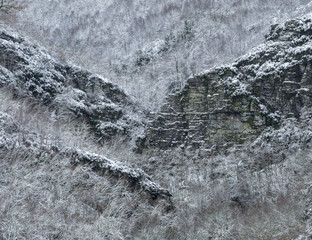 Snow covered shale cliffs