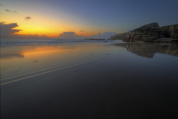 Spectacular sunset saturated with calm on a beach