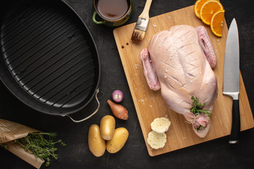 Fresh Raw Whole Duck on Cutting Board with Ingredients Ready to Cook. Recipe Preparation Concept. - 267977884