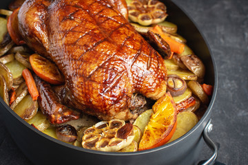 Christmas Duck Baked with Potatoes, Carrots and Oranges. Festive Food Concept.