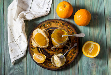 Breakfast of orange jam on rusks close-up