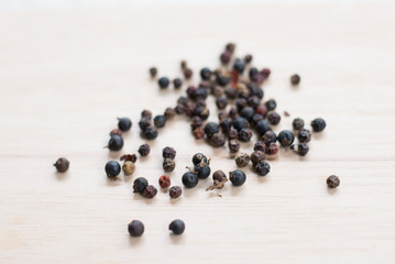 black pepper on wooden