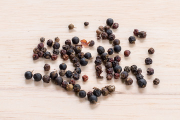 black pepper on wooden