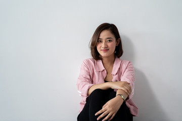 Fototapeta premium attractive asian young woman looking at camera. portrait of young female over white