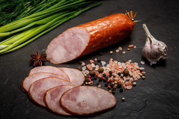 chunk of smoked ham sausage with garlic and green onions