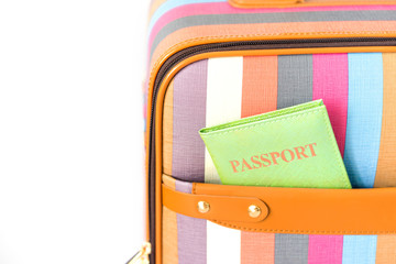 bright suitcase  passport on background