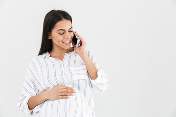 Smiling young pregnant businesswoman