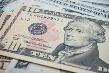 Obraz na płótnie Canvas Portrait of American statesman Alexander Hamilton and Federal Reserve System (FED) seal macro detail on a ten dollar banknote or bill. Concept of central bank and USA or world economic financial.