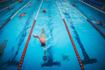 Professional man swimmer inside swimming pool.