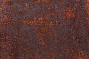 Rusty background. Old rusty metal sheet. Red rusted wall of the garage. Brown background. Grunge texture.