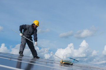 operation and maintenance in solar power plant ; engineering team working on checking and maintenance in solar power plant ,solar power plant to innovation of green energy for life