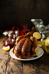 Fototapeta na wymiar Chicken roast with spices, lemon and cherries