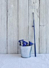 toy fish in a bucket with a fishing rod