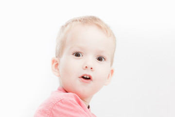 Photo of adorable young happy boy looking at camera.