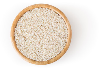 Sesame seeds in wooden bowl isolated on white background with clipping path