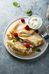 Crepes stuffed with cottage cheese cream
