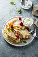 Crepes stuffed with cottage cheese cream