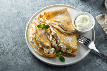 Crepes stuffed with cottage cheese cream