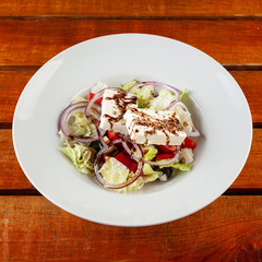Greek salad on a white plate